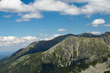 Top of a stone mountain close up on a summer sunny day with blue sky. Poland, Zakopane, Tatry