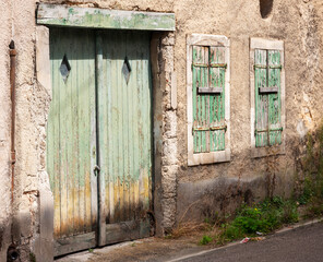green and blue shutters in small french burgundy town