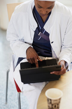 High angle view of female doctor using digital tablet