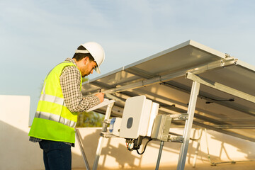 Professional engineer using a photovoltaic inverter for solar panels