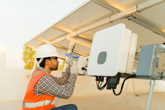Engineer installing solar panels working on the electrical connection