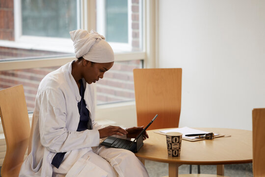 Young female doctor using tablet at work