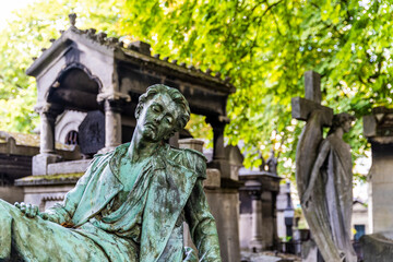 Detail of a statue in the monunmental Montmartre Cemetery, built in early 19th century, in the...