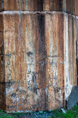 A badly damaged concrete wall