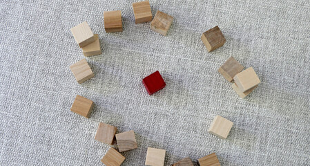 small wooden blocks on fabric background.Creative and different ideas