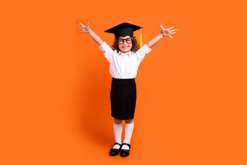 Photo of excited schoolkid raise hands celebrate graduate school isolated vivid color background