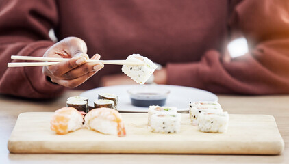 Sushi, seafood and brunch with hands of person in store for restaurant, Japanese cuisine and menu....