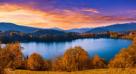 beautiful landscape in autumn with a big lake and a beautiful sunset