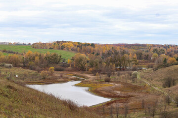 autumn landscape with river and forest