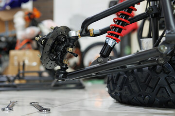 Worker make a ATV in the workshop. Preparing the quad bike for sale. © Studio Peace