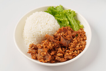 Fried sliced pork with garlic and pepper, Thai Recipe in white plate on white background.
