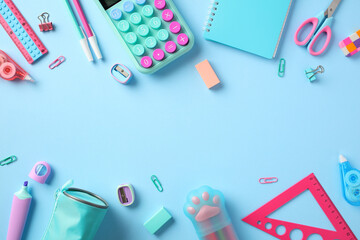 Back to school concept. Frame made of school supplies on pastel blue background. Top view. Flat lay.
