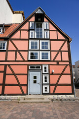 Old half-timbered house with the inscription sewing shop on the door.
