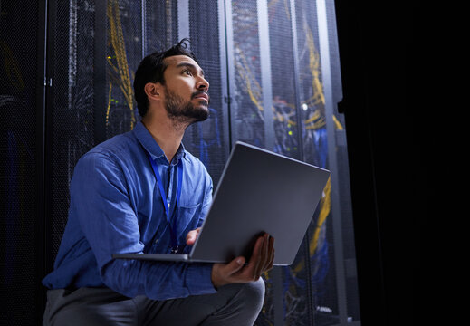 Data center, laptop or developer typing for cybersecurity glitch, machine or to search online on servers system. IT support, server room or engineer fixing network for information technology solution