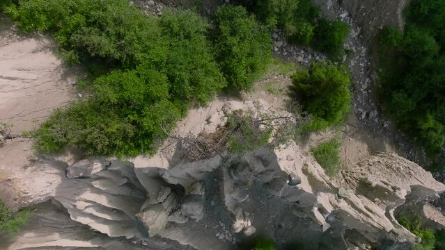 Aerial Drone shot over the Earth pyramids of Platten in South Tyrol in Alps near to Bruneck or Brunico, Bolzano, Italia