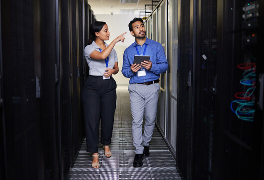 People, server room and inspection or teamwork for cybersecurity, engineering and coding solution on tablet. Engineering man and woman or manager walking and check data center with digital technology