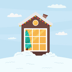 Christmas house with a large window covered with snow.
