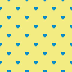 Seamless blue heart pattern on yellow background.Simple heart shape seamless pattern in diagonal arrangement. Love and romantic theme background.