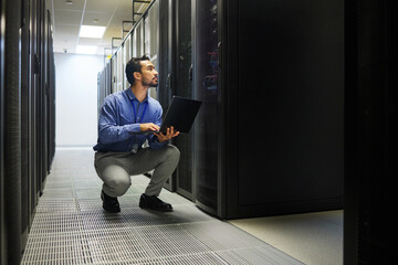 Server room, laptop or man typing for cybersecurity glitch, machine or to search online on servers...