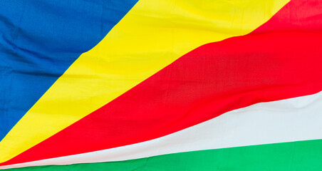 The flag of Seychelles waving in wind, close up