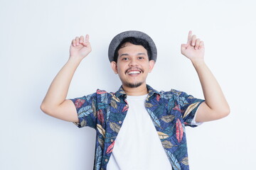 Happy excited face asian man wearing beach shirt showing something with his hand, isolated on white background for advertisement. travel and holidays concepts. - Powered by Adobe