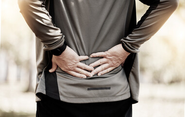Runner, hands and back pain in park, injury or outdoor for fitness, training or muscle emergency....