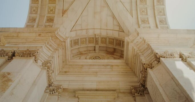 Overview inside the marble triumphal arch in classicism style, movement from bottom to top