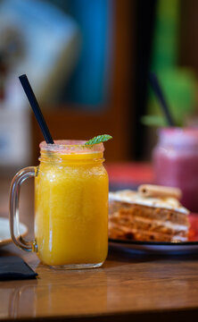 orange smoothie with a carrot cake on the back with ice cream