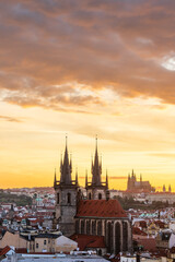 Aerial view of Prague cityscape during sunset. The Church of Our Lady before Tyn in the foreground.