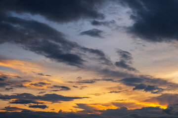 Fiery nightfall cloudscape. Sky background.