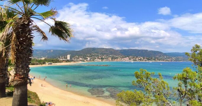 Beach of "Le Gouron" seen from Bormes-les-Mimosas looking toward Le Lavandou, sunny, windy summer day with few clouds, France