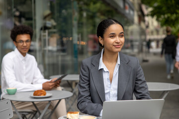 Colleagues working on project together and looking focused