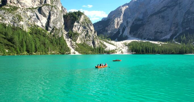 Lake Braies (or Lago di Braies) famous lake in Dolomites Alps Italy Europe extra wide panorama aerial fly forward, dolly footage in HDR