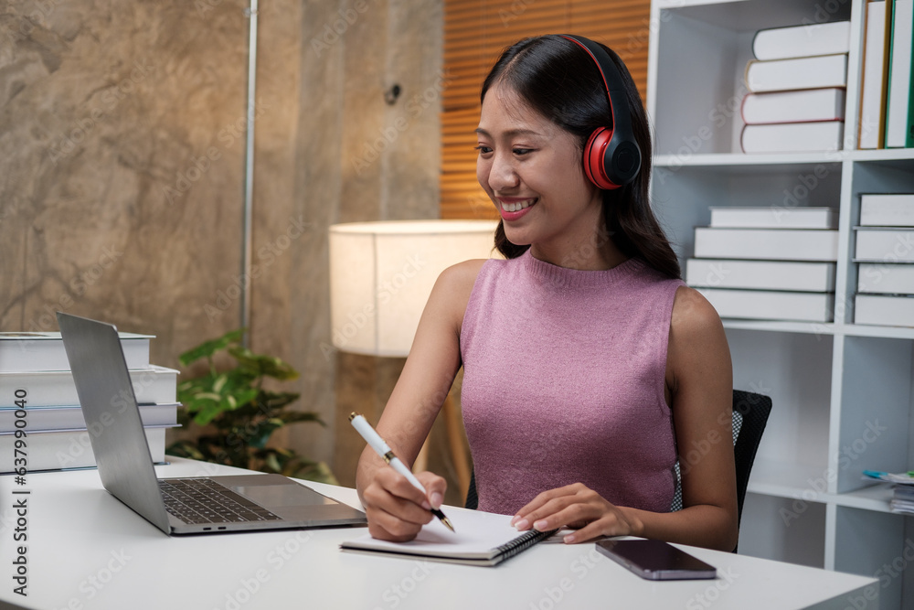 Poster asian female student studying via video conferencing system while at home.