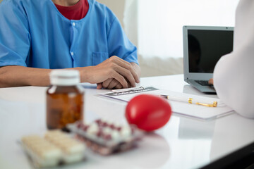 A heart patient visits a doctor for advice on health care and medication to treat heart disease...