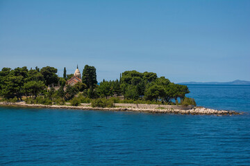 Naklejka premium Petrinovic Mausoleum on the coast at Supetar on Brac Island in Croatia in spring. Known as Mauzolej Obitelji Petrinovic in Croatian