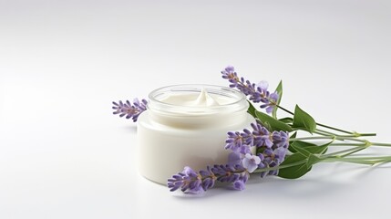 Fototapeta na wymiar A serene arrangement of a jar of cream for face skin and lavender flowers on a clean white surface