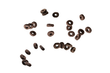 Chocolate rings cereal spill out into a bowl. Breakfast.