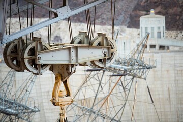 Dawning Legacy: 4K Video of Hoover Dam with Original Crane Illuminated by Sunrise