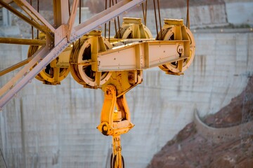 Dawning Legacy: 4K Video of Hoover Dam with Original Crane Illuminated by Sunrise
