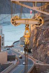 Dawning Legacy: 4K Video of Hoover Dam with Original Crane Illuminated by Sunrise