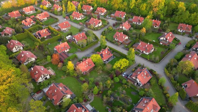Aerial view of residential houses at spring.  neighborhood, suburb. Real estate, drone shots, sunset, sunlight, from above.
