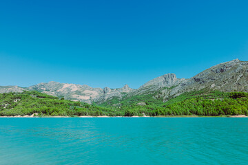 Mountain landscape, picturesque mountain lake on a summer morning, large panorama, Spain, Guadalest. High quality photo