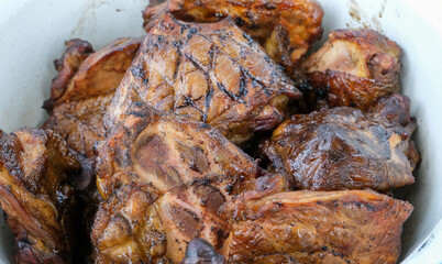 Close up on details of homemade chicken steak on barbecue grill. Barbecue, grill and food concept.