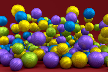 Many of flying multicolor fitness ball or fitball falling on red background