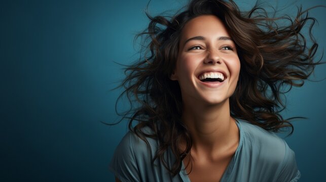 pretty woman laughing on a colorful background