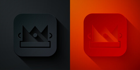 Paper cut King playing card icon isolated on black and red background. Casino gambling. Paper art style. Vector