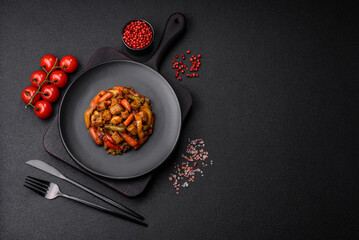 Mix of vegetables corn, carrots, peppers, broccoli, onions in teriyaki sauce on a ceramic plate