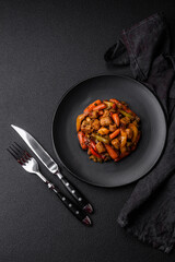 Mix of vegetables corn, carrots, peppers, broccoli, onions in teriyaki sauce on a ceramic plate