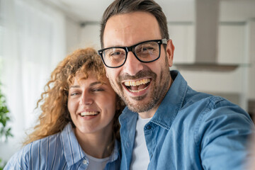 Happy adult caucasian couple at home husband and wife family concept